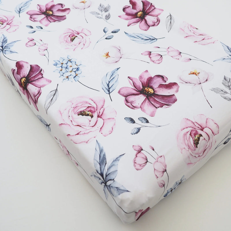 Vintage floral changing pad cover with pink and blue flowers, soft stretch fabric.