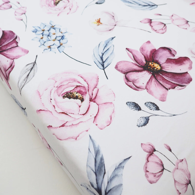 Vintage floral changing pad cover with soft, stretchy fabric.