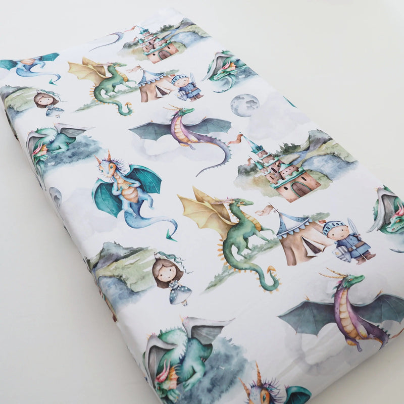 Dragons and knights themed changing pad cover in soft, stretchy fabric.