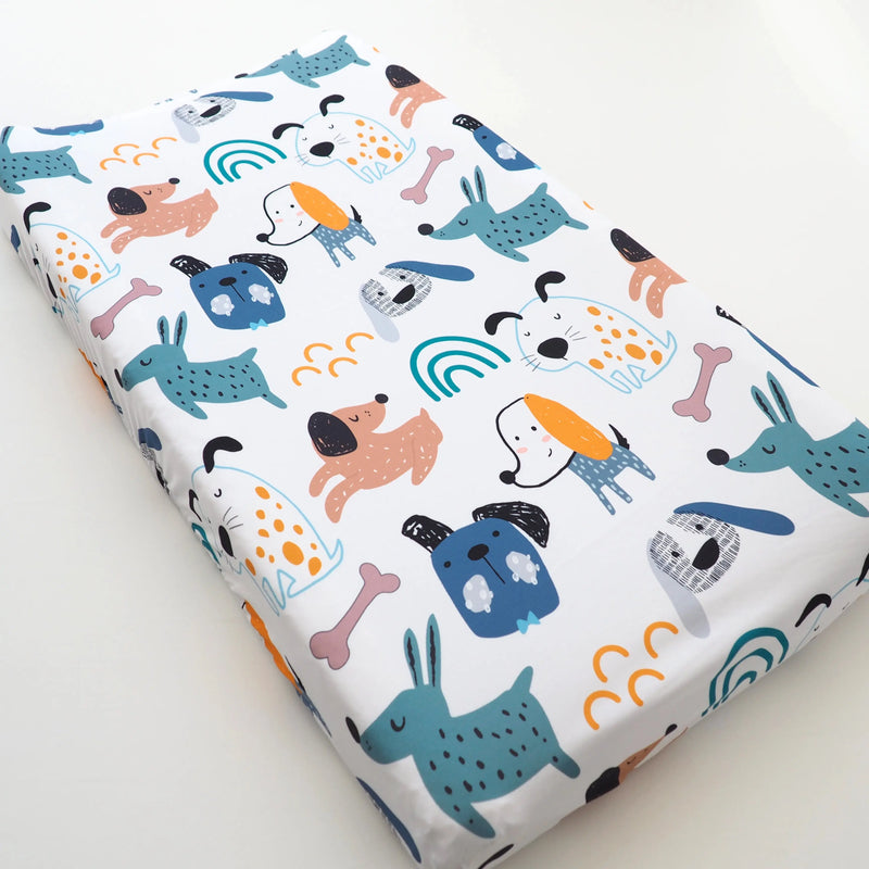 Changing pad cover with playful dog design, fits most pads, 32x16 inches, soft and stretchy fabric.