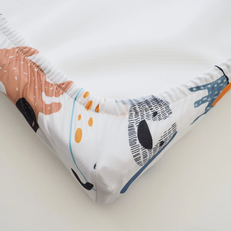 Changing pad cover with dog design, soft and stretchy fabric.