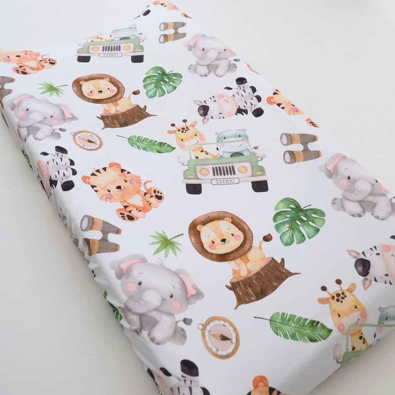 Safari-themed changing pad cover with animal prints, soft fabric, fits most pads.