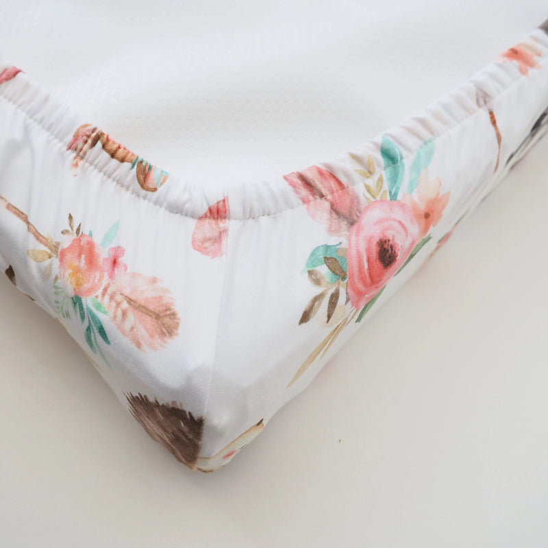 Woodland Tribe changing pad cover with soft floral design.
