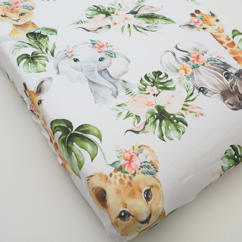 Changing pad cover with Africa animal design on soft, stretchy fabric.