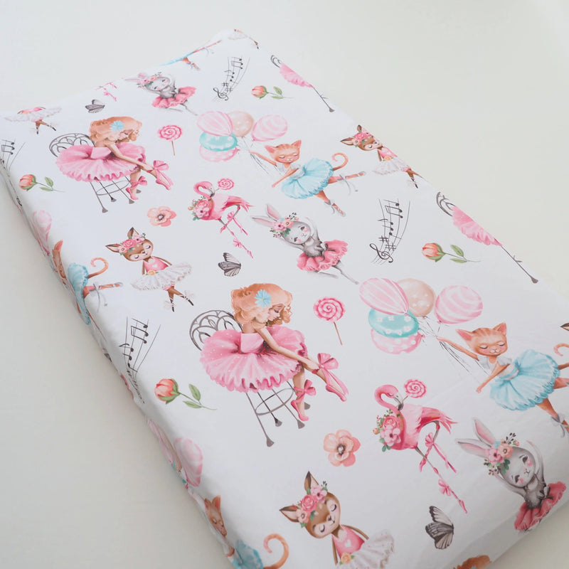 Ballerina-themed changing pad cover with soft fabric and playful design.