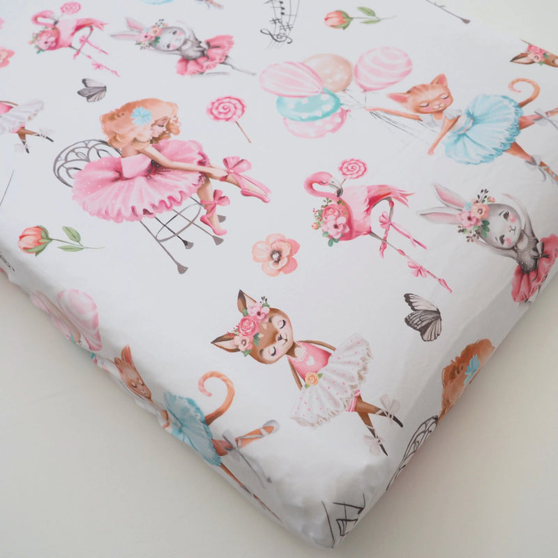 Ballerina-themed changing pad cover with soft fabric and colorful illustrations.