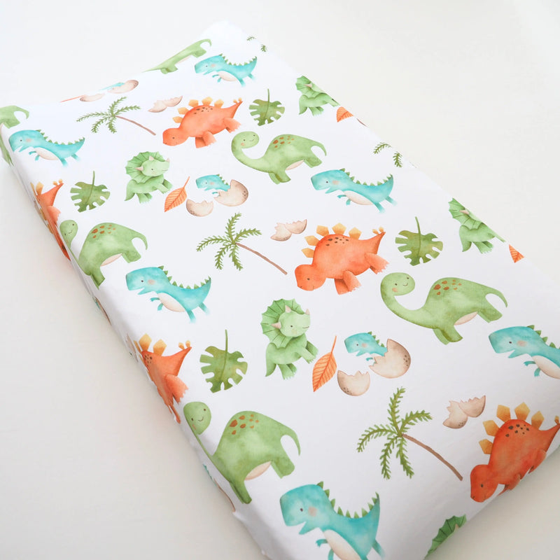 Dinosaurs themed changing pad cover with soft and stretchy fabric for baby's nursery.