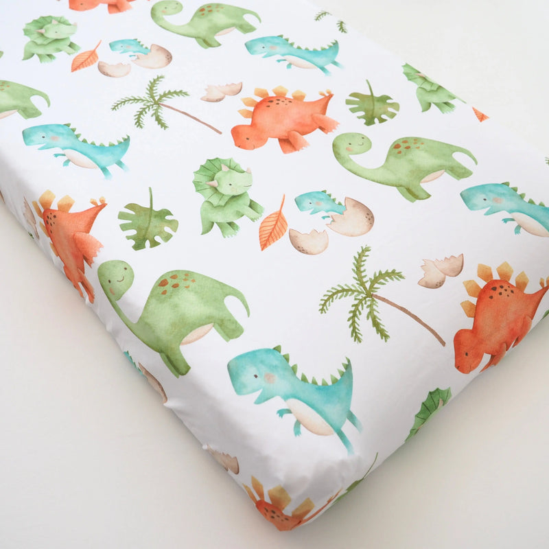 Dinosaur print changing pad cover, soft and stretchy fabric.