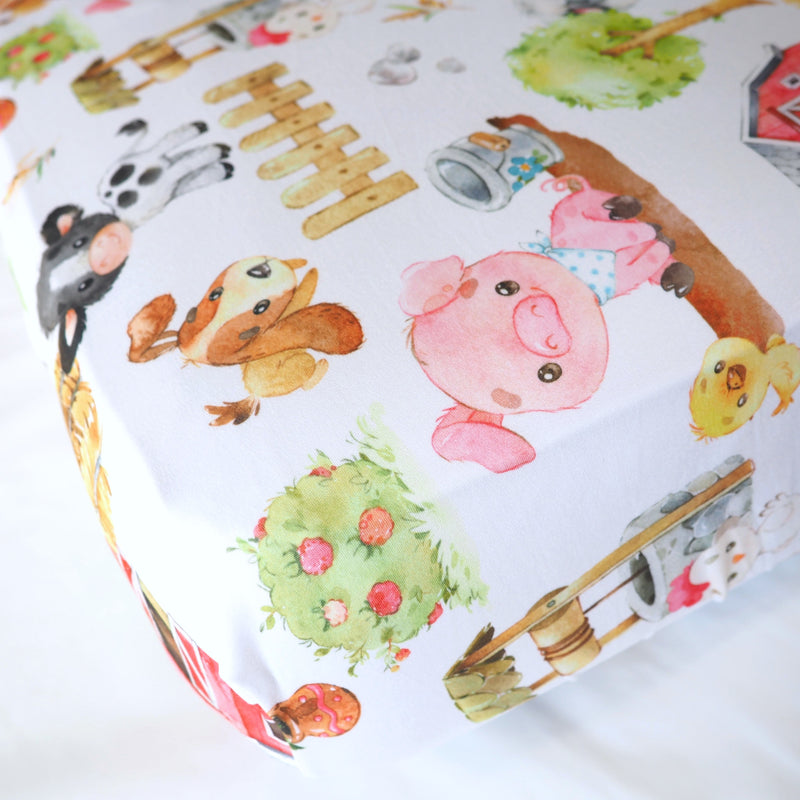 Fitted crib sheet with farm animal print design.