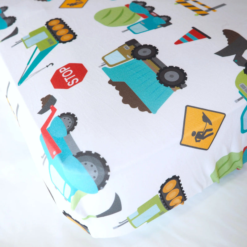 Fitted crib sheet with construction truck pattern, soft rayon blend.