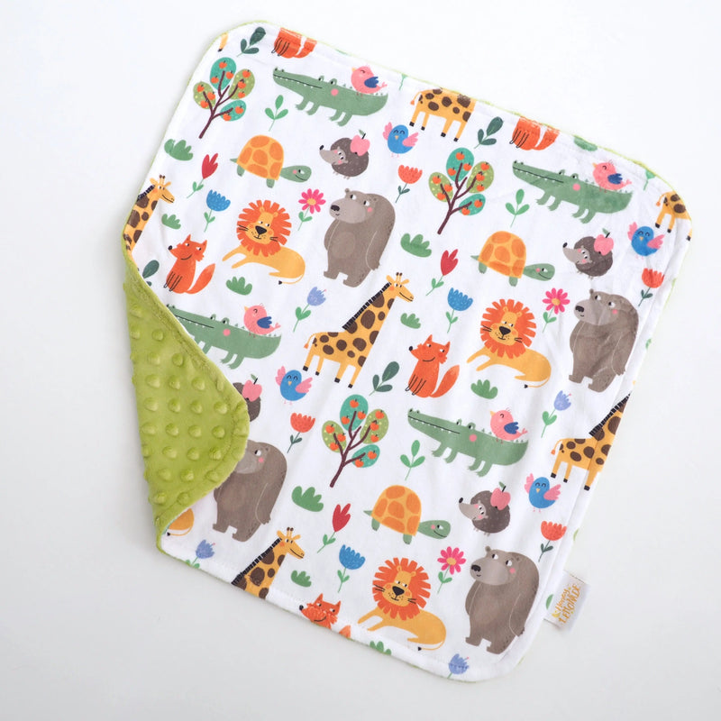 Mini Minky Zoo Party toddler blanket with colorful animal print and green Minky dot texture.