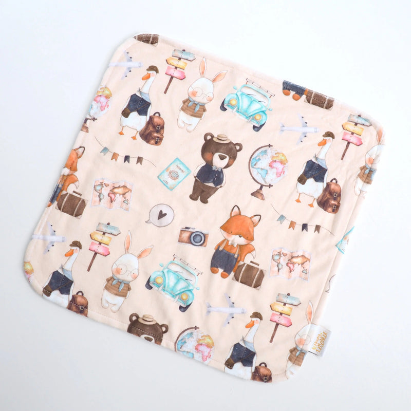 Mini Minky toddler blanket with world explorer print, perfect for travel and sensory play.