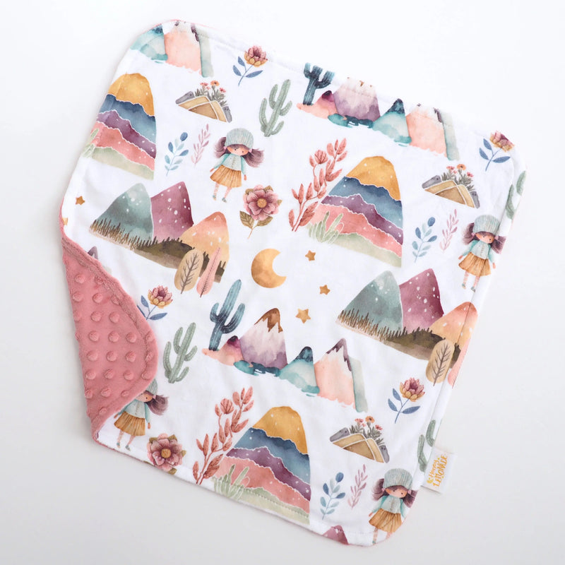 Mini Minky Dreamland toddler blanket with mountain and floral print, soft minky backing, 18x18 inches.