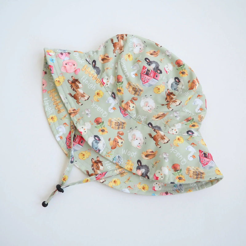 Baby and kids sun hat with farm animal pattern, lightweight and UV protective.