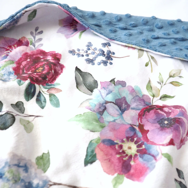 Blue floral baby and toddler minky blanket with soft texture and vibrant colors.