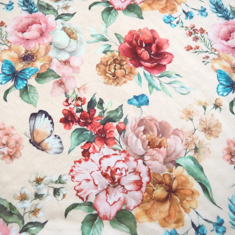 Floral patterned lightweight blanket with butterflies on premium minky fabric.