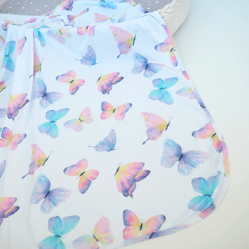 Buttery soft and stretchy swaddle blanket with colorful butterfly design.