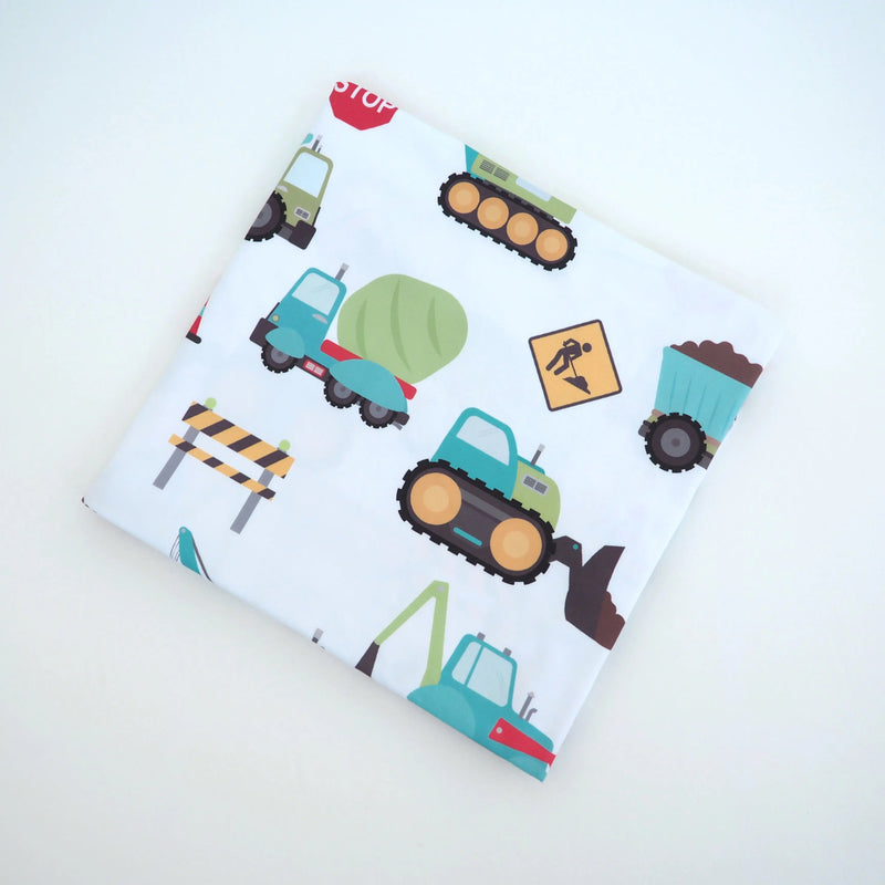 Buttery soft and stretchy swaddle blanket with construction truck pattern, 47x47 inches.