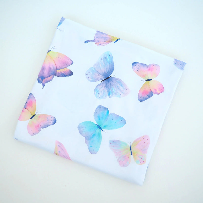 Buttery soft and stretchy swaddle blanket with colorful butterfly pattern