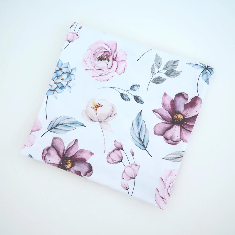 Buttery soft and stretchy swaddle blanket with vintage floral design.