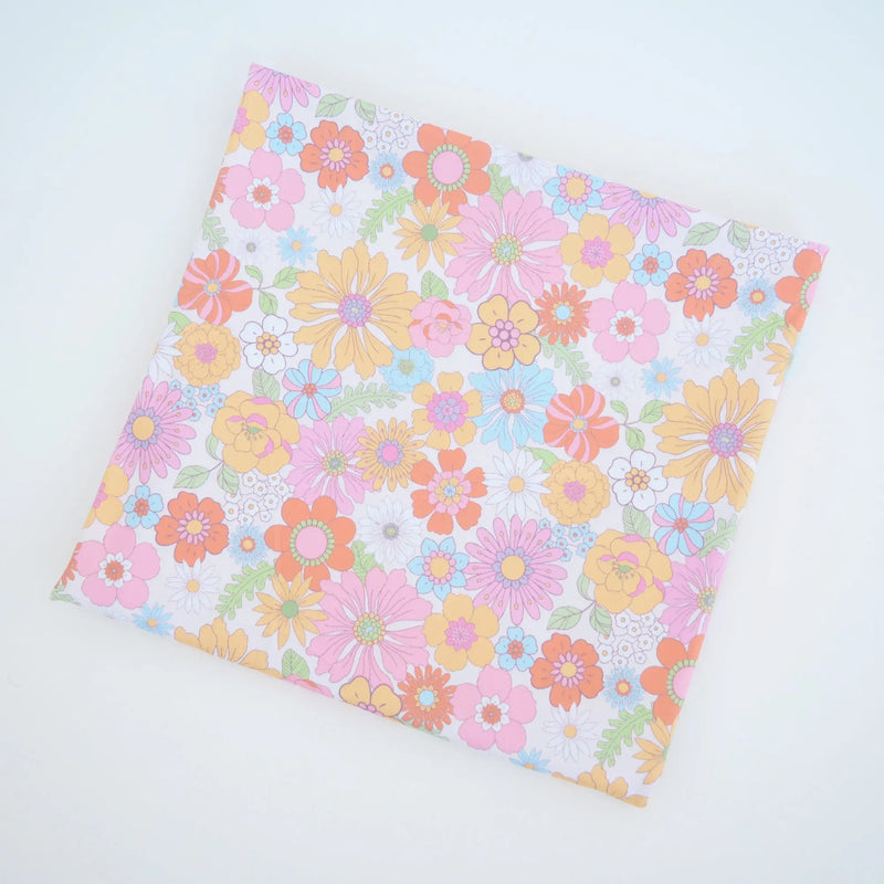 Buttery soft and stretchy swaddle blanket with retro floral pattern, 47x47 inches, perfect for baby comfort.