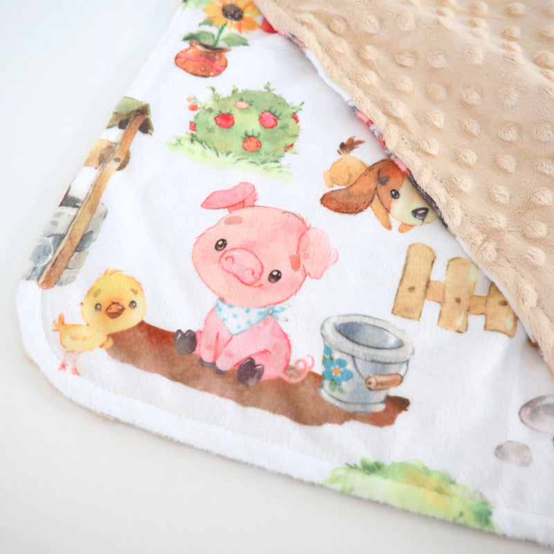 Mini Minky blanket with farm animal design and beige Minky dot texture, perfect for toddlers.