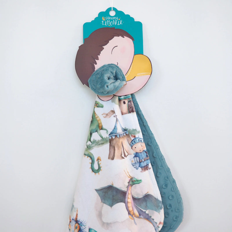 Mini Minky blanket with dragons and knights design, perfect for toddlers; premium Minky fabric ensures softness and sensory stimulation.