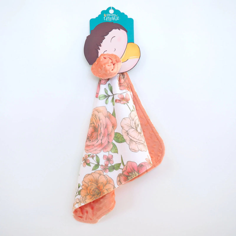 Mini Minky blanket with botanical floral design, ideal for toddlers; soft, lightweight, and portable.
