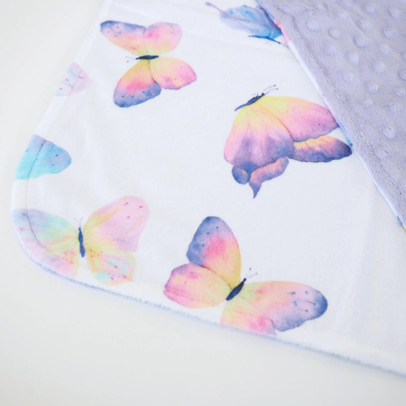 Mini Minky butterfly toddler blanket with colorful butterfly pattern and soft Minky dot texture.