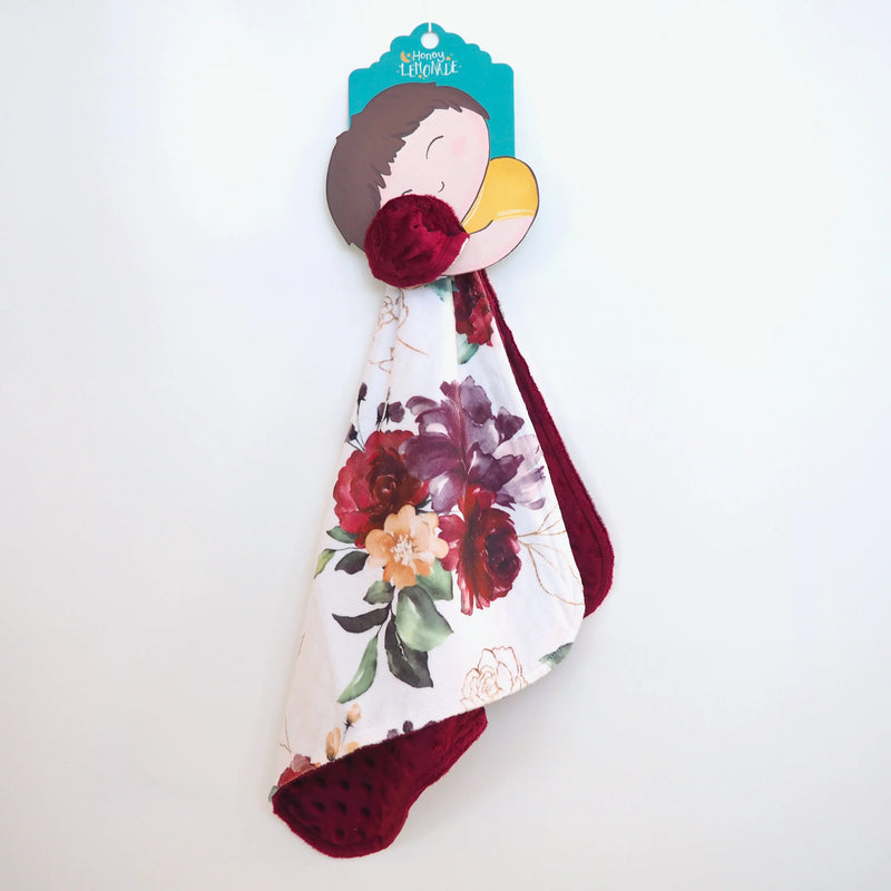 Mini Minky red floral blanket for toddlers, lightweight and soft, perfect for travel and sensory stimulation.