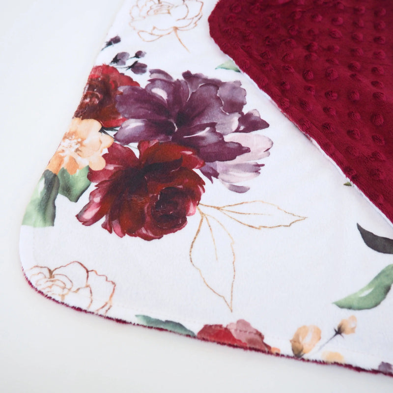 Red floral mini minky blanket for toddlers; lightweight, soft, sensory texture.
