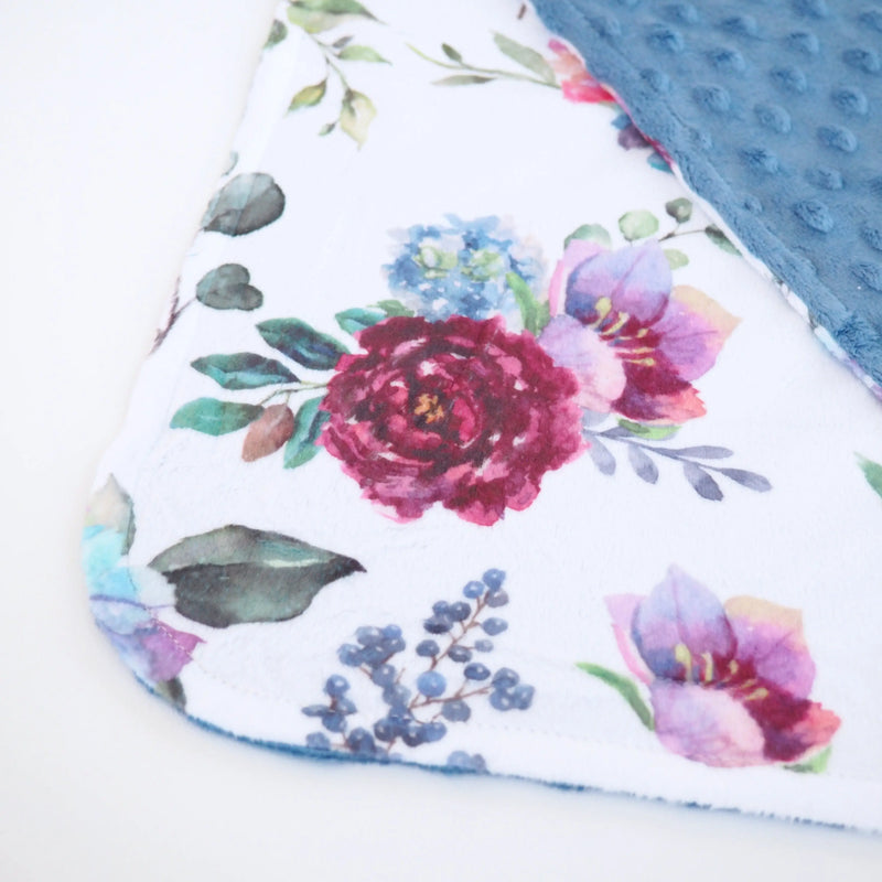 Blue floral mini Minky blanket with soft Minky dot texture, perfect toddler size.