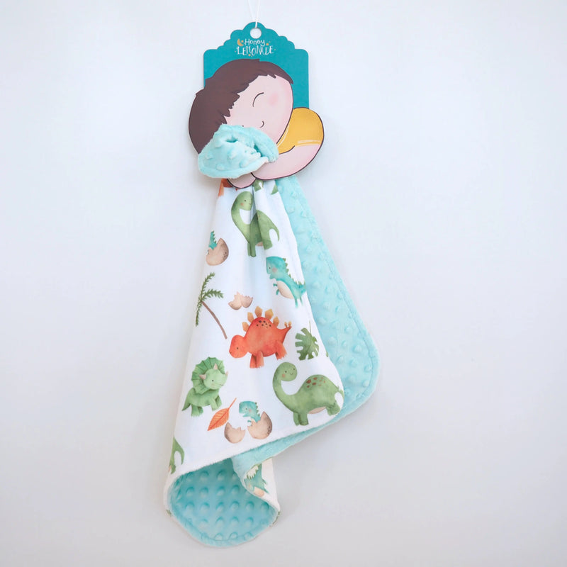 Mini Minky dinosaur-themed toddler blanket with soft minky fabric, perfect for travel and sensory stimulation.