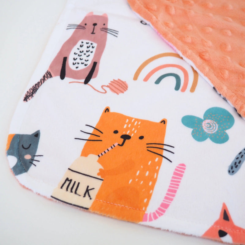 Mini Minky cat-themed toddler blanket with vibrant illustrations and soft Minky dot texture.