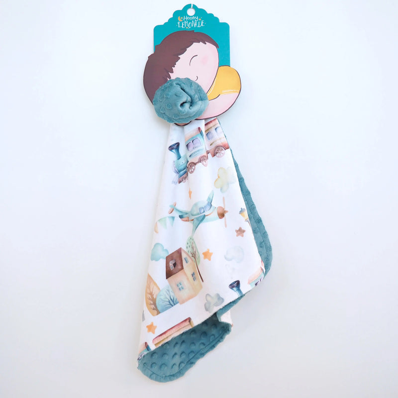 Mini Minky toddler blanket with airplane and train design, lightweight and sensory stimulating.