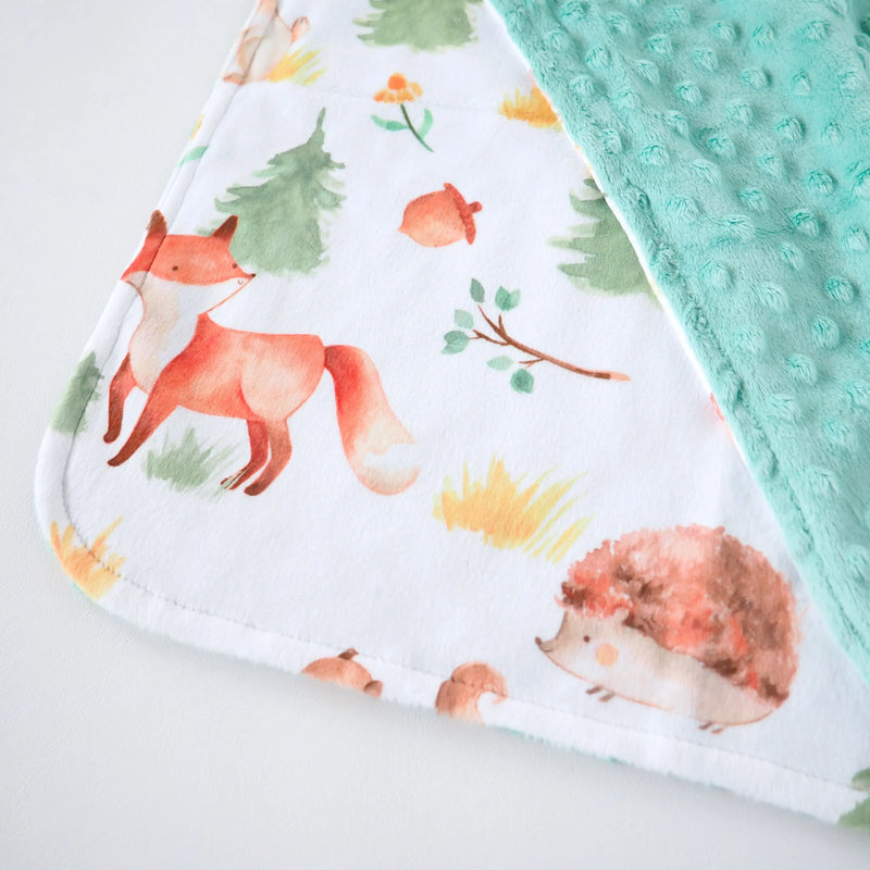 Mini Minky Forest Friends blanket featuring forest animals and trees, made from soft Minky fabric, perfect for toddlers.