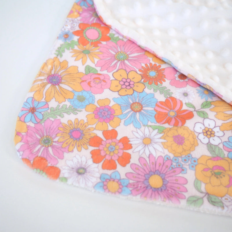 Mini Minky toddler blanket with retro floral pattern and soft minky dot texture.