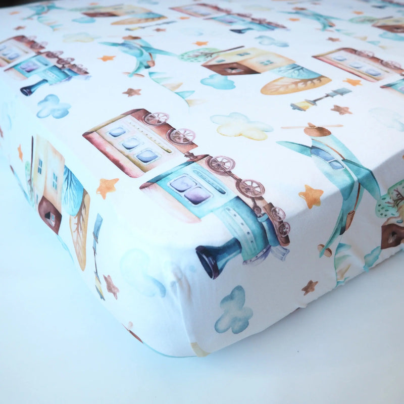 Fitted crib sheet with airplane and train pattern, soft and perfect for photos.