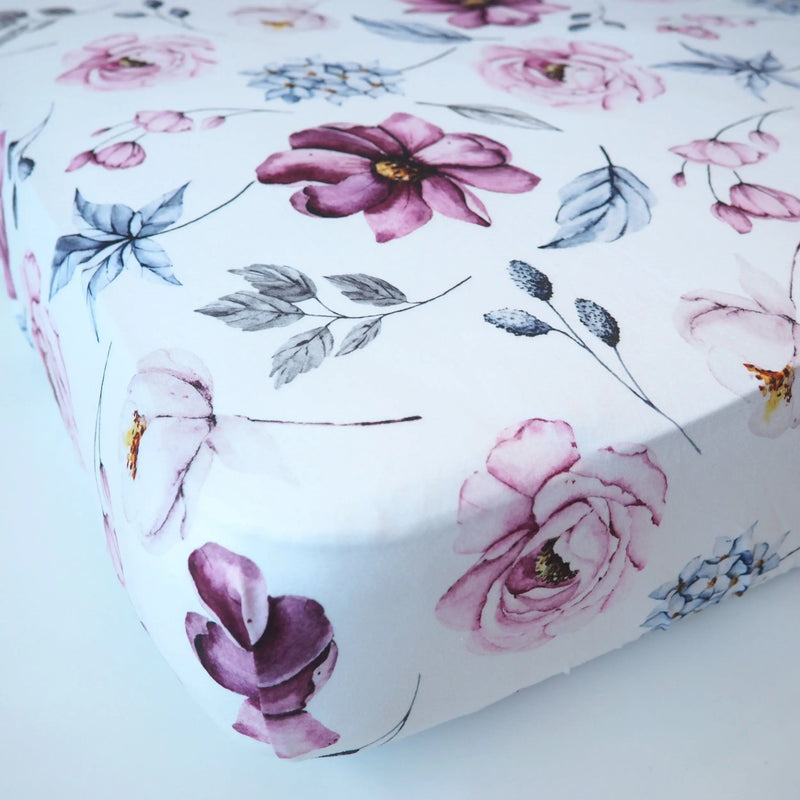 Vintage floral fitted crib sheet with soft fabric and unique pattern, ideal for photo backdrops.