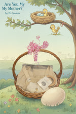 Baby gift basket with clothes and accessories on a black surface