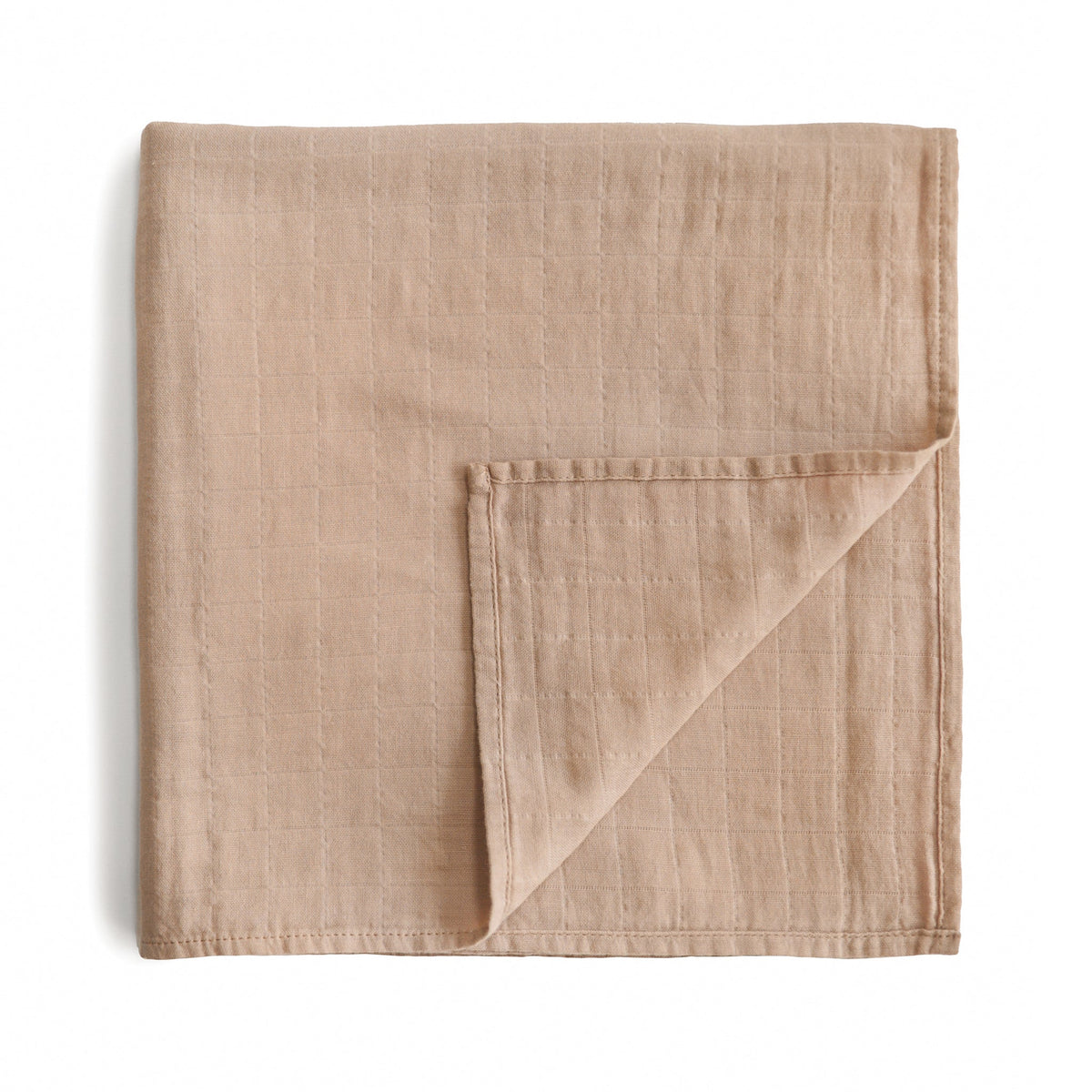 Soft, breathable Mushie organic cotton muslin swaddle blanket.