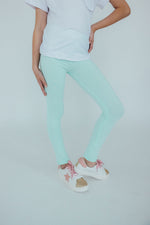 Mila & Rose organic pastel green baby leggings.