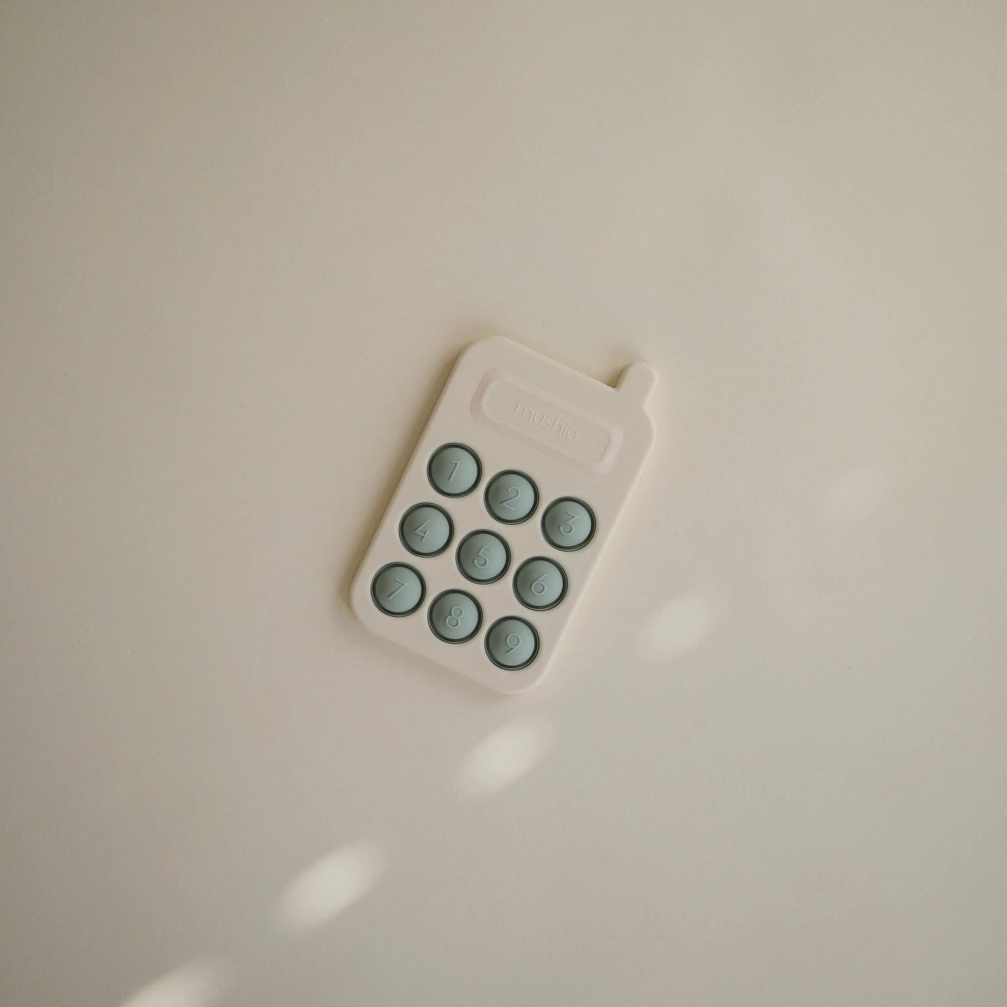 Phone Press Toy for Sensory Exploration and Fine Motor Skill Development Mushie Everetts Place: Online Boutique