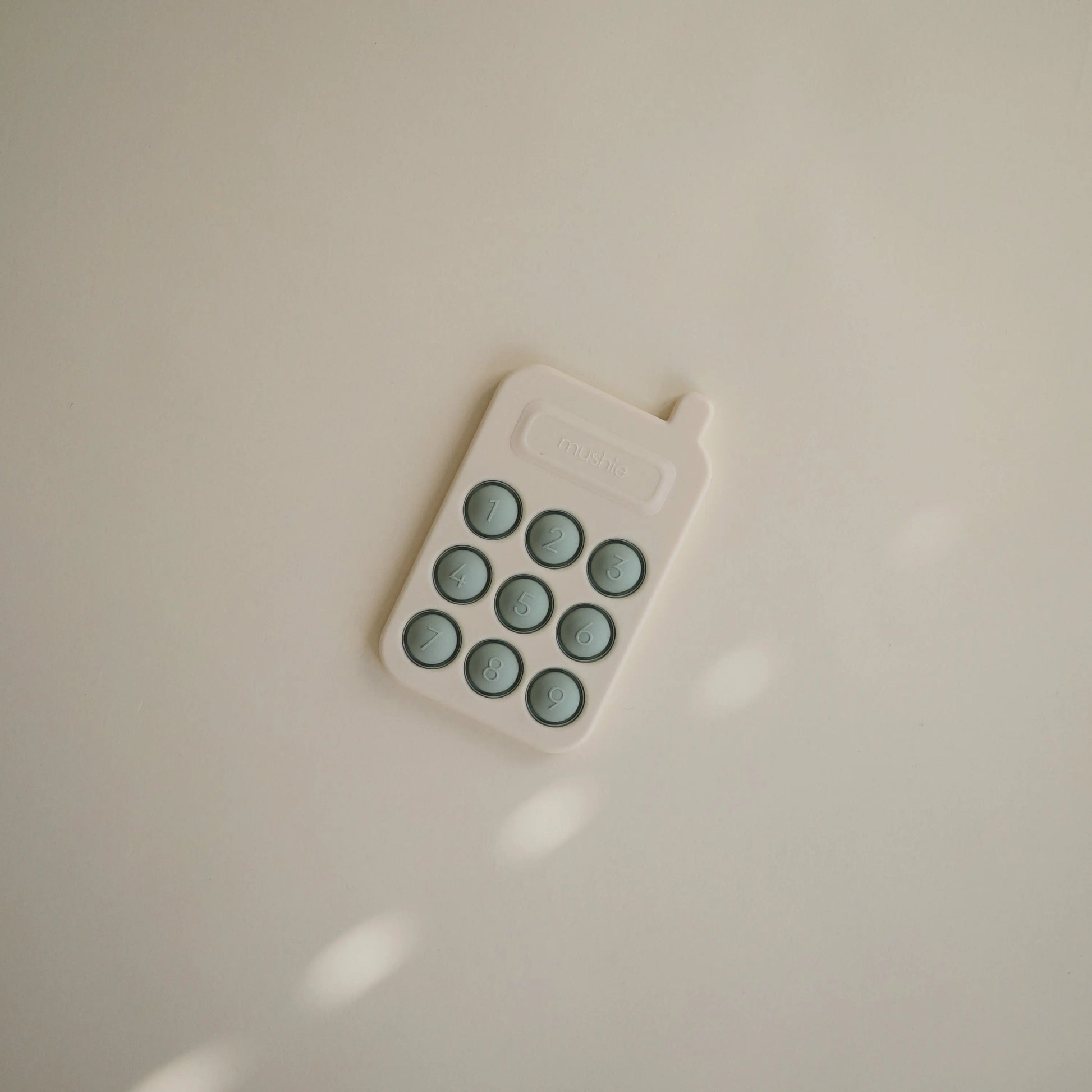 Phone Press Toy for Sensory Exploration and Fine Motor Skill Development Mushie Everetts Place: Online Boutique