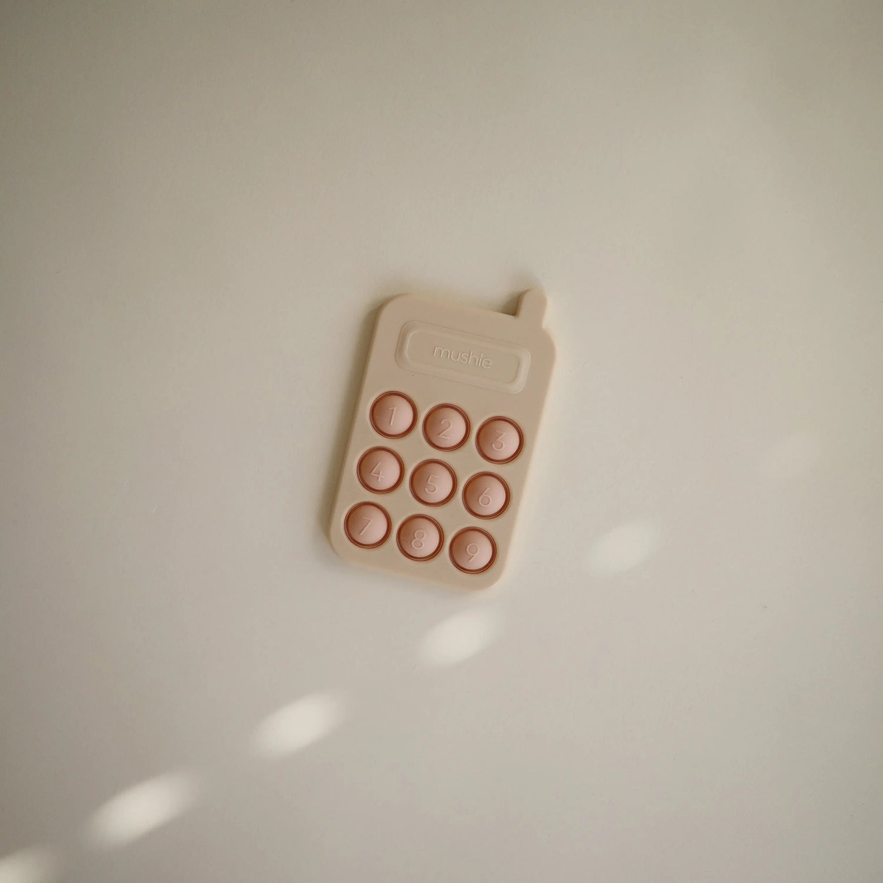 Mushie Phone Press Toy for Sensory Exploration and Fine Motor Skill Development - Baby & Toddler > Baby Toys & Activity Equipment > Push & Pull Toys Press Toy