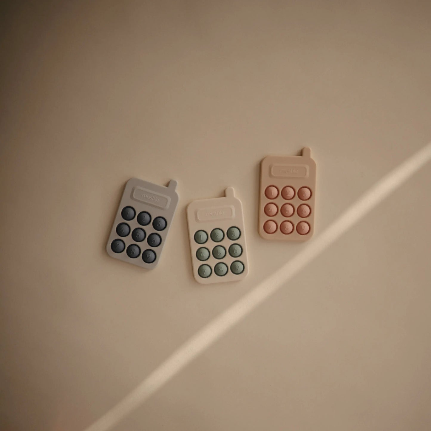 Phone Press Toy for Sensory Exploration and Fine Motor Skill Development Mushie Everetts Place: Online Boutique