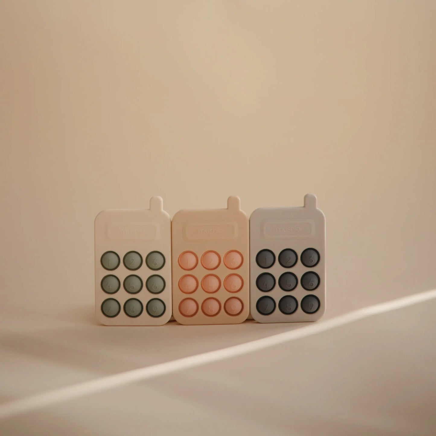 Phone Press Toy for Sensory Exploration and Fine Motor Skill Development Mushie Everetts Place: Online Boutique