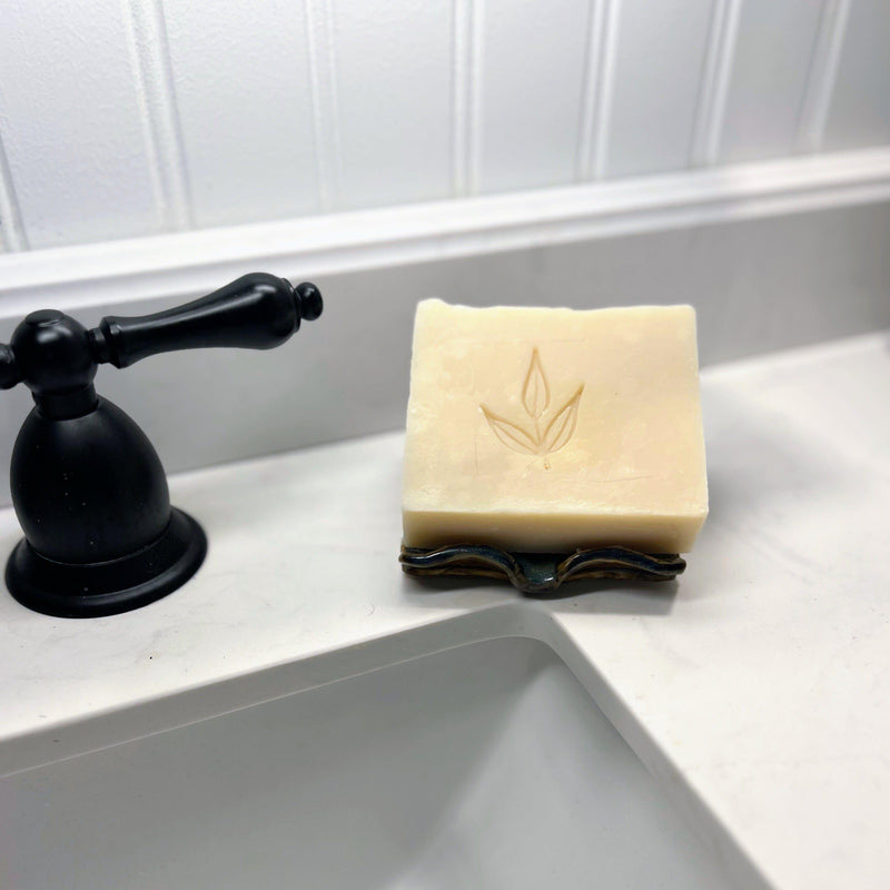 Scented Castile Bar Soap on a bathroom sink counter.