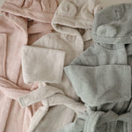 Mushie baby bear hooded robe with ears, soft and cozy.