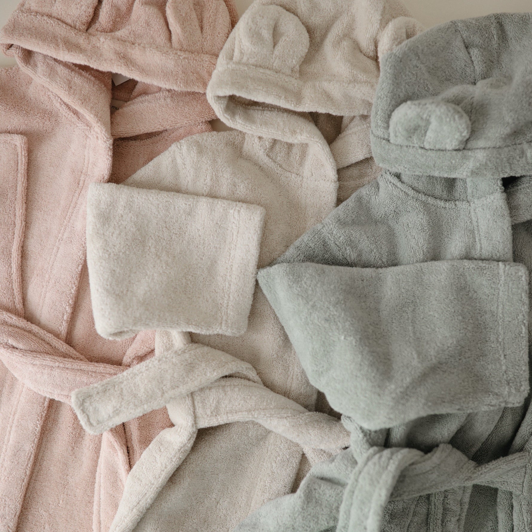 Mushie baby bear hooded robe with ears, soft and cozy.